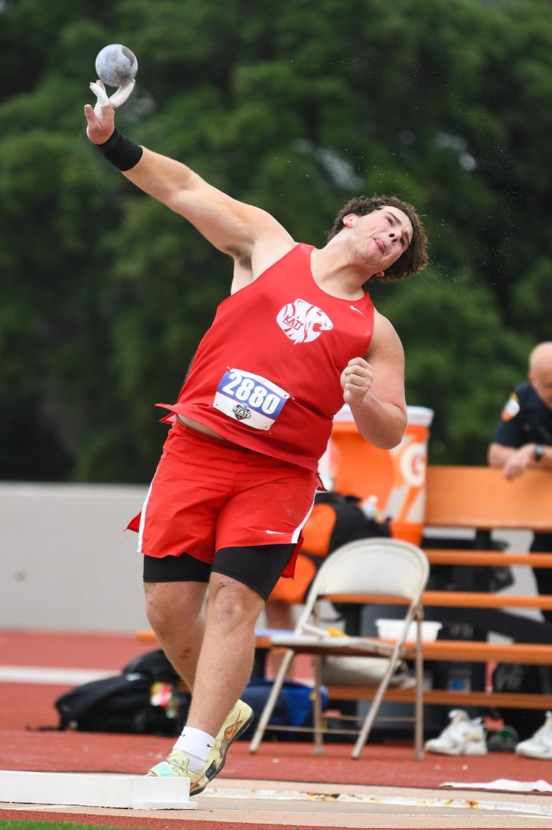 Portfolio, Superior: Adam Carter competes in the 6A boys shot put events at the state championship.