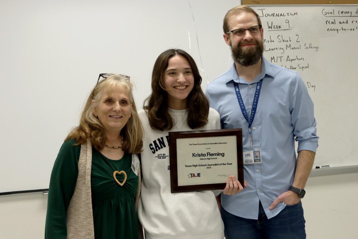 TAJE State Director Lisa Roskens and Adviser Steven Jones surprise 2025 Texas Journalist of the Year Krista Fleming at a ceremony at Hebron High School on March 4, 2025. Fleming will represent Texas in the national Journalism Education Association contest in April.